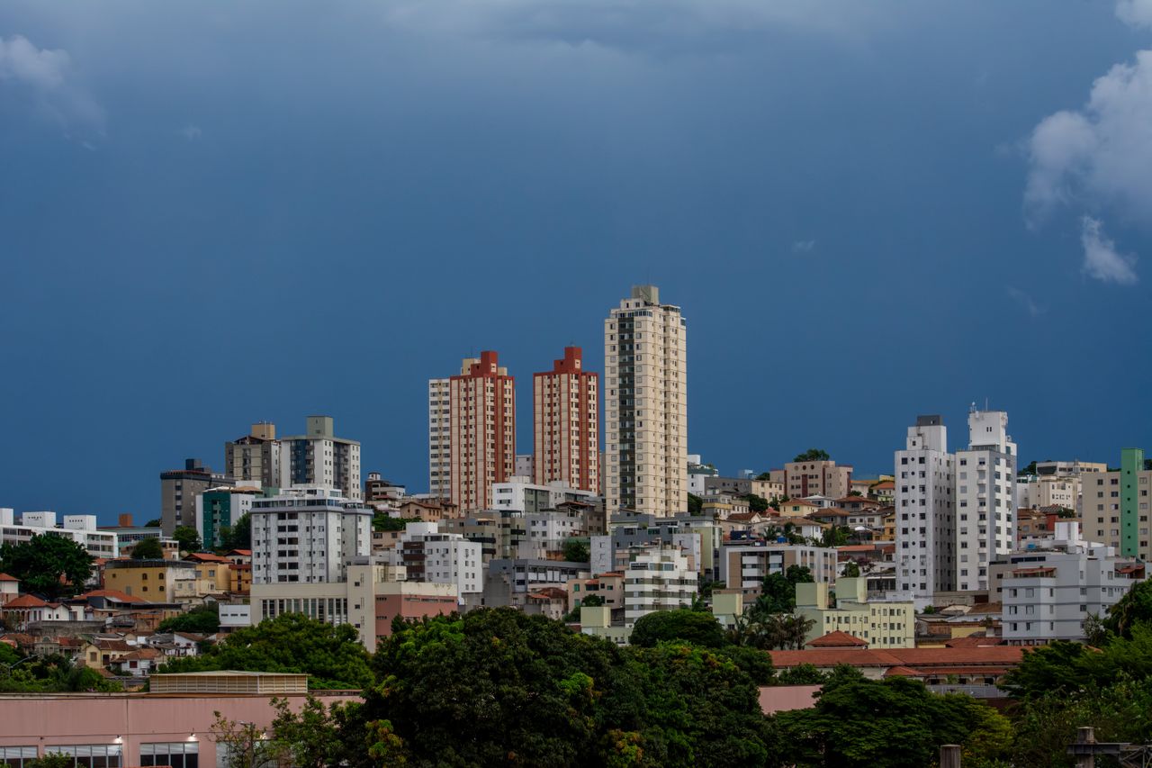 Stunning view of Belo Horizonte's skyline under a dramatic sky, showcasing diverse architecture.
