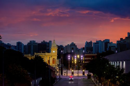Free Stunning sunset over Belo Horizonte, featuring the historic architecture of Station Square with vibrant city skyline. Stock Photo