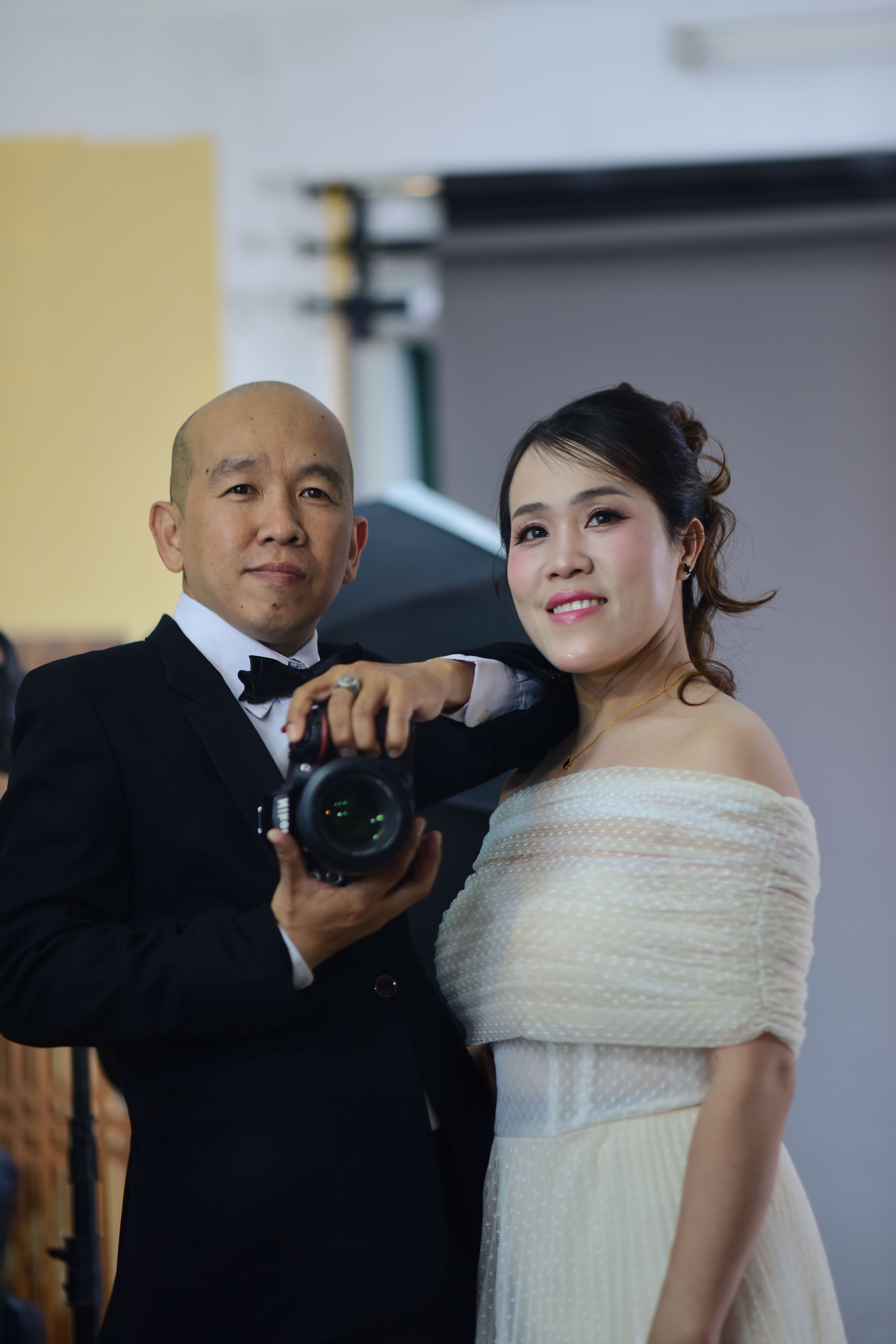 Elegant Couple Posing Indoors at Formal Event · Free Stock Photo