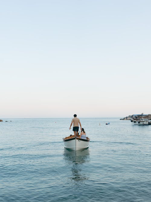 People Riding A Boat