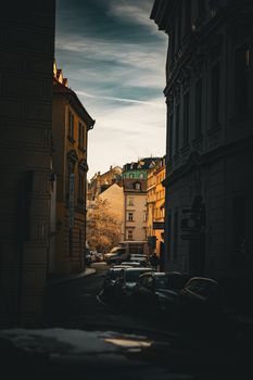 Beautiful Prague street captured at twilight, showcasing historic architecture and vintage charm.