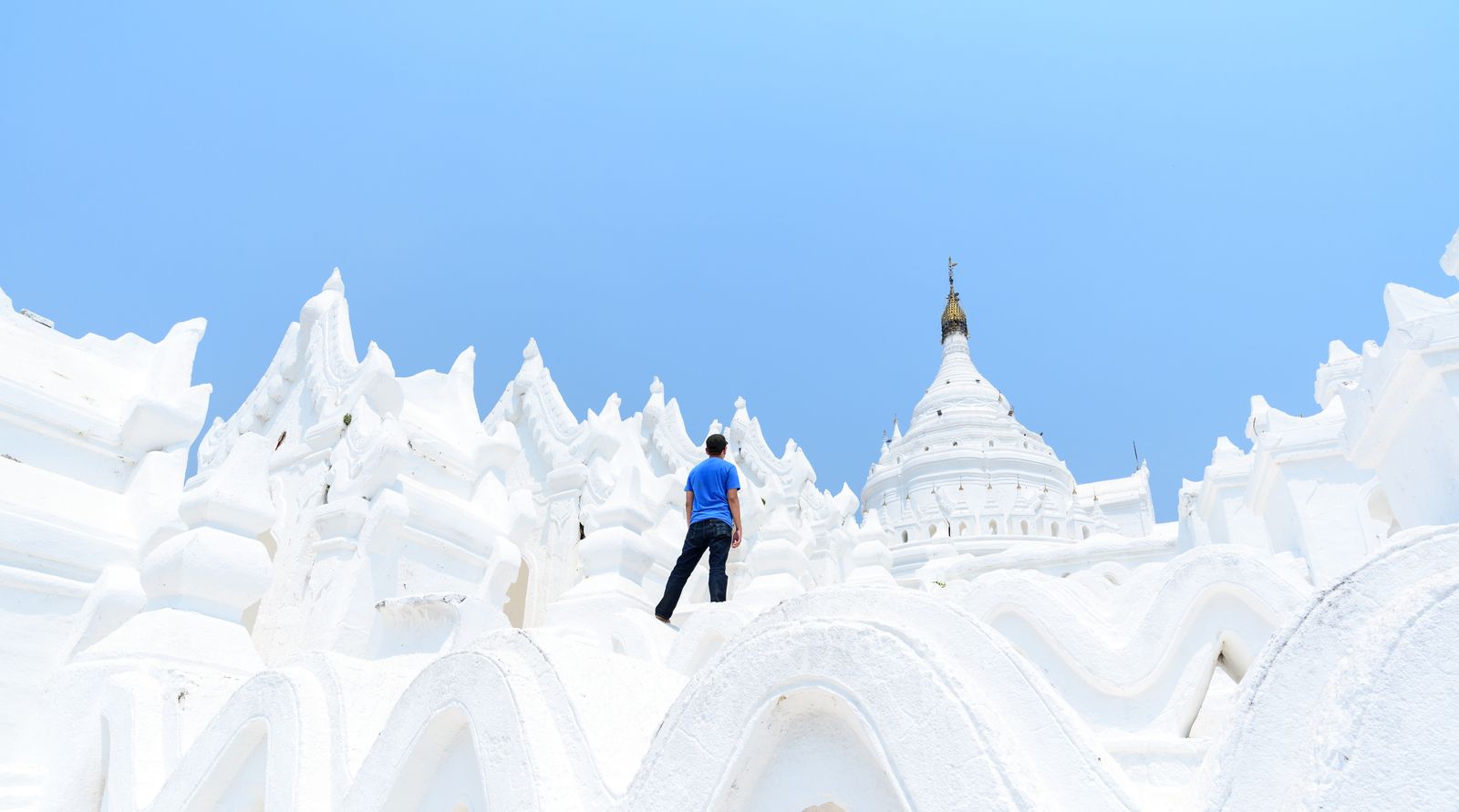 Business handshake with city skyline in background representing doing business in Myanmar