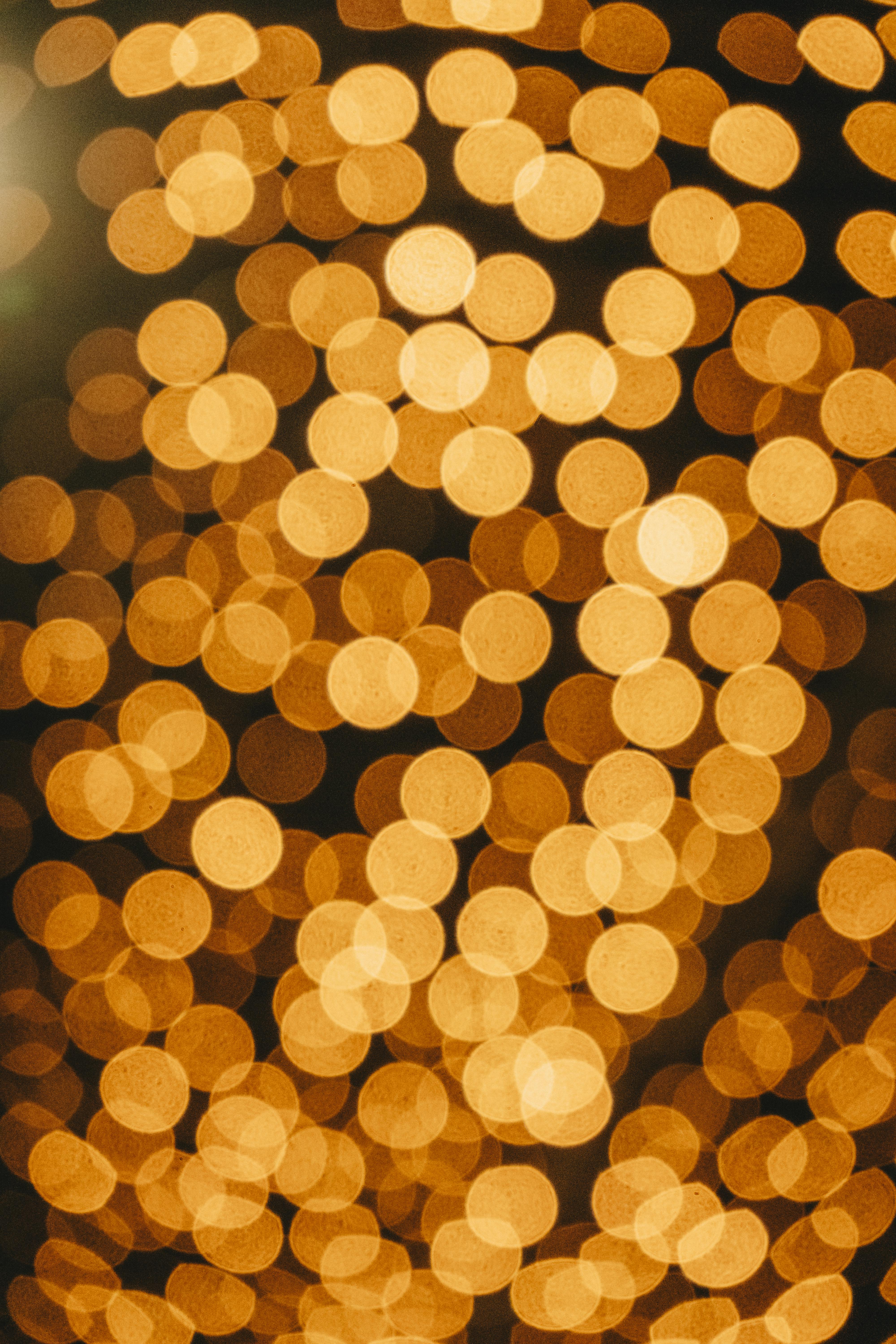 Warm golden bokeh lights creating an abstract and festive background.