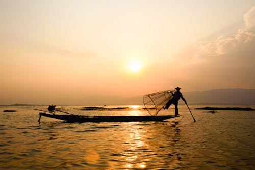 Silhouette Photography of Person on Boat