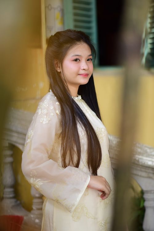 Free Charming portrait of a young woman in traditional attire with long hair and delicate embroidery. Stock Photo