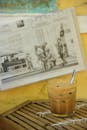 Chilled Iced Coffee with Newspaper Background
