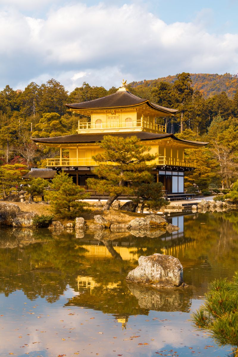 Golden Pavilion of Kinkaku-ji temple reflecting in the pond in Kyoto