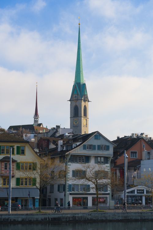 Free Charming view of Fraumünster Church spire against Zurich's vibrant skyline. Stock Photo