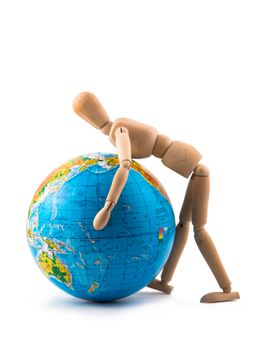 A wooden mannequin pushes a blue globe isolated on white background. 35602944