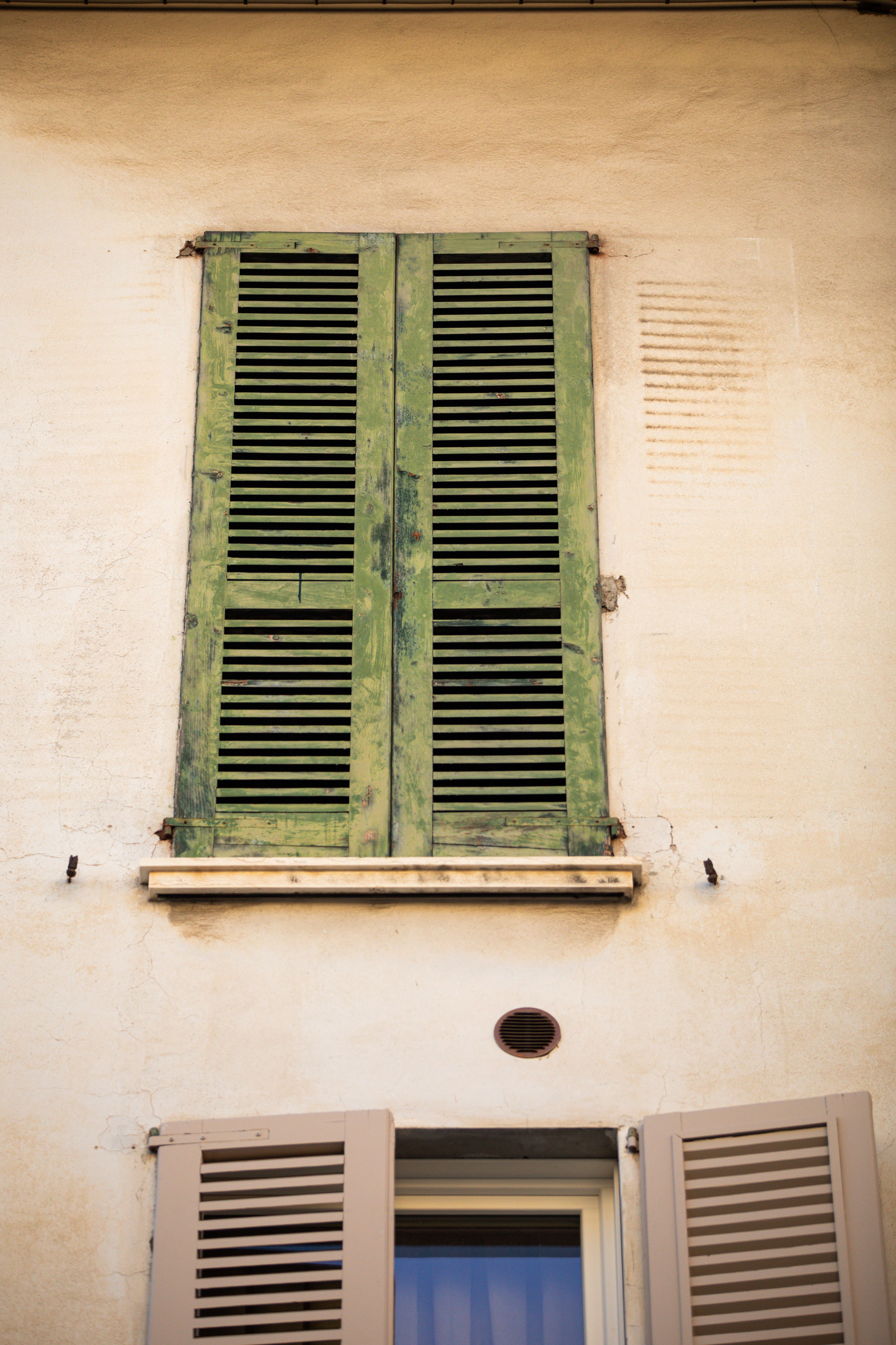Rustic Green Shuttered Window on Antique Building · Free Stock Photo