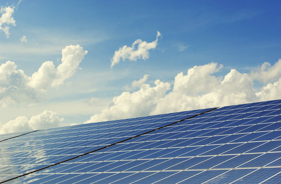 Solar panels in a sunlit field