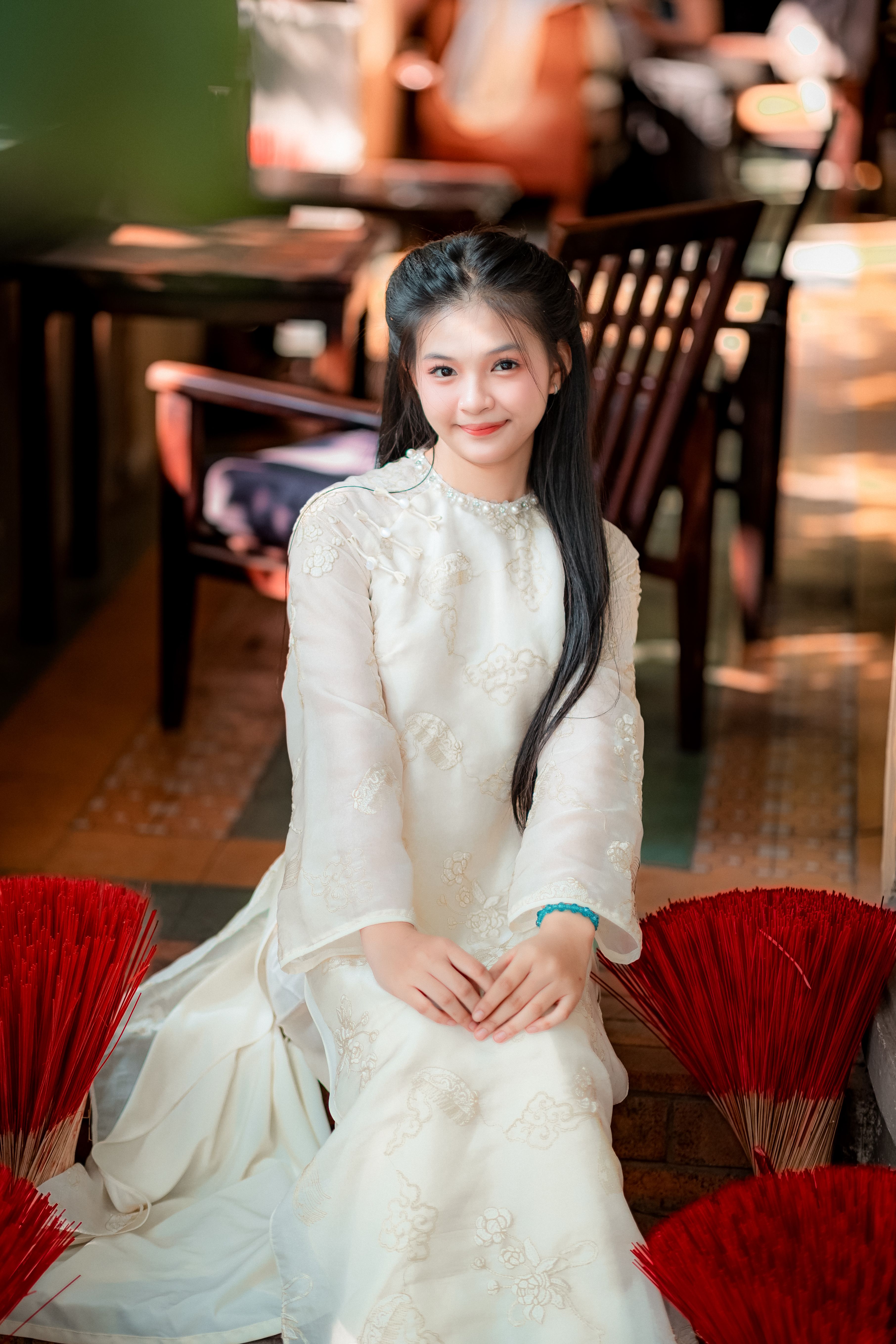 Elegant Woman in Traditional White Dress Indoors · Free Stock Photo