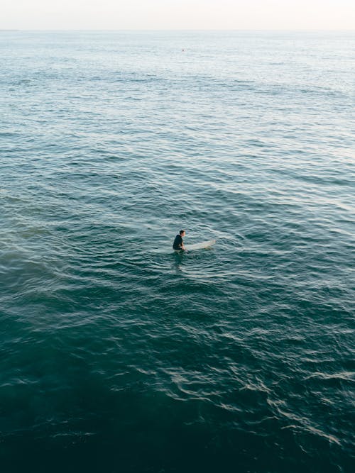 Free Person on Surfboard Stock Photo