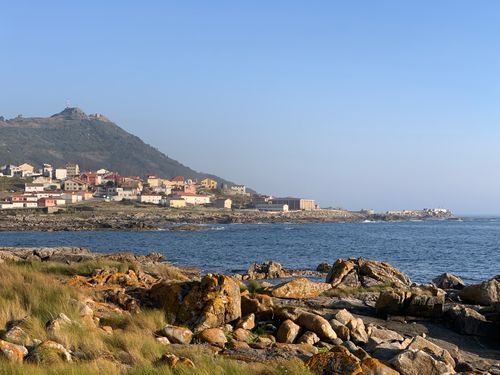 Free A picturesque coastal village in Northern Portugal with ocean views and rocky shoreline. Stock Photo