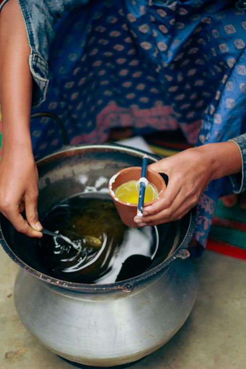 Free Hands making eco-friendly candles in Dhaka, Bangladesh using traditional methods. Stock Photo