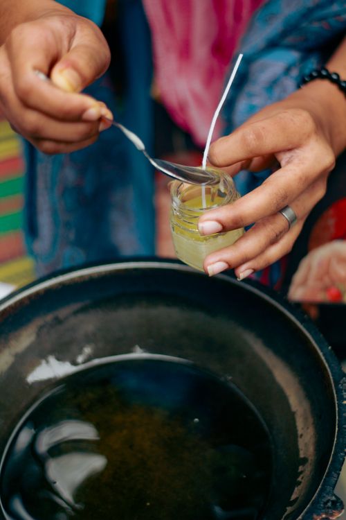 Free Hands creating eco-friendly candles with natural materials in Dhaka, Bangladesh. Stock Photo