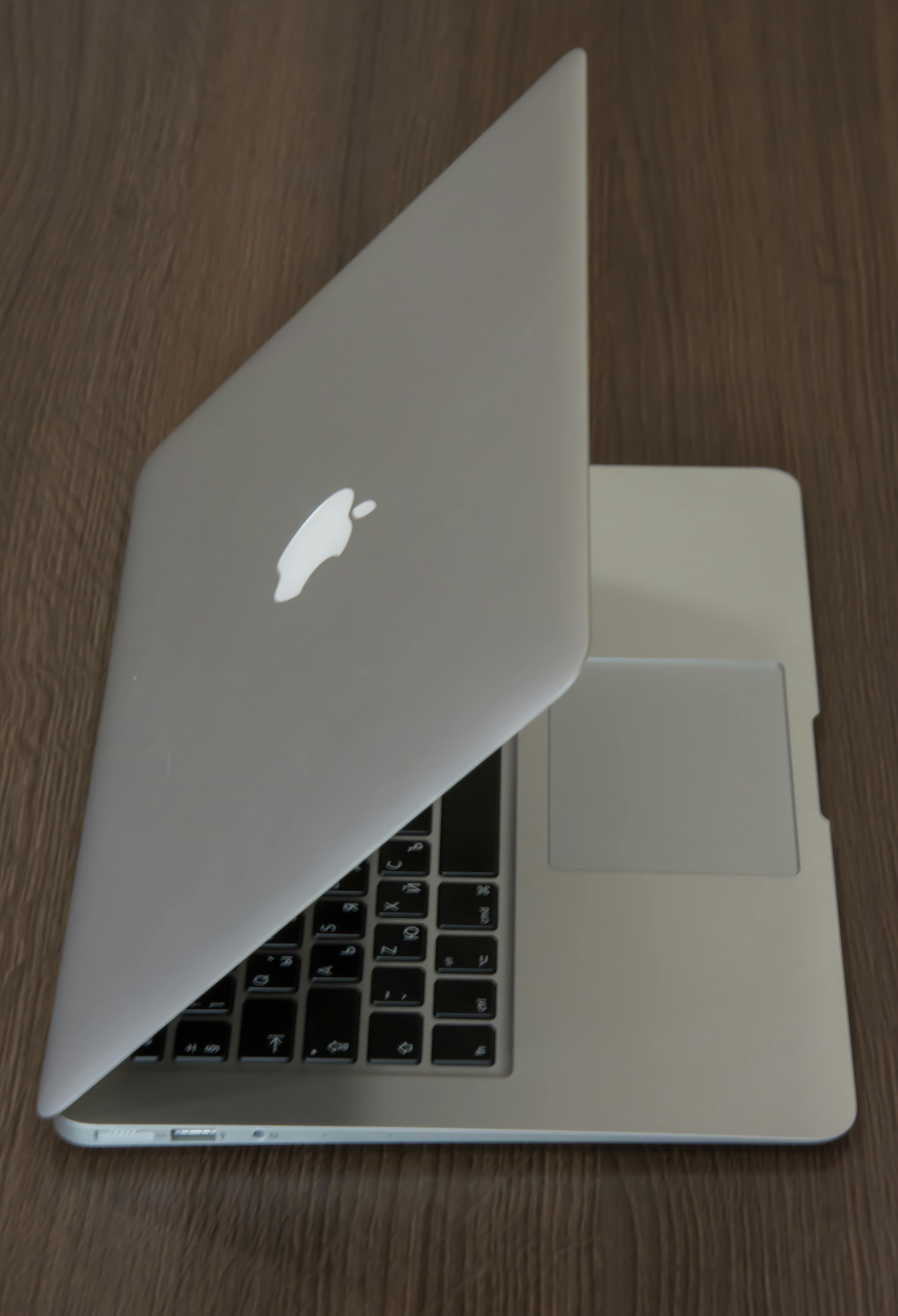 Silver Macbook on Brown Surface \u00b7 Free Stock Photo