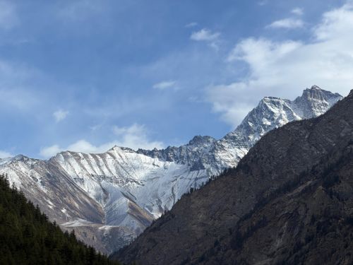 Free Majestic view of snow-covered mountains under clear blue sky. Stock Photo