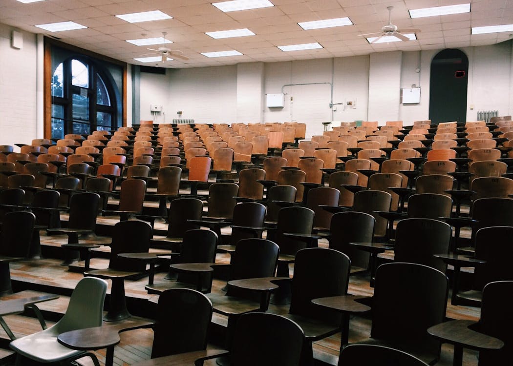 An empty lecture theatre with the lights on