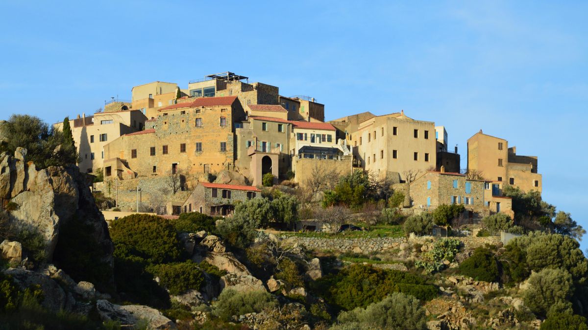 The golden-stone hilltop village of Sant'Antonino on granite outcrops