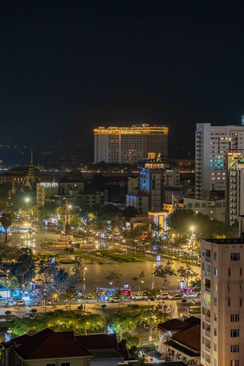 Free Captivating view of Phnom Penh's bustling nightlife with illuminated buildings and streets. Stock Photo