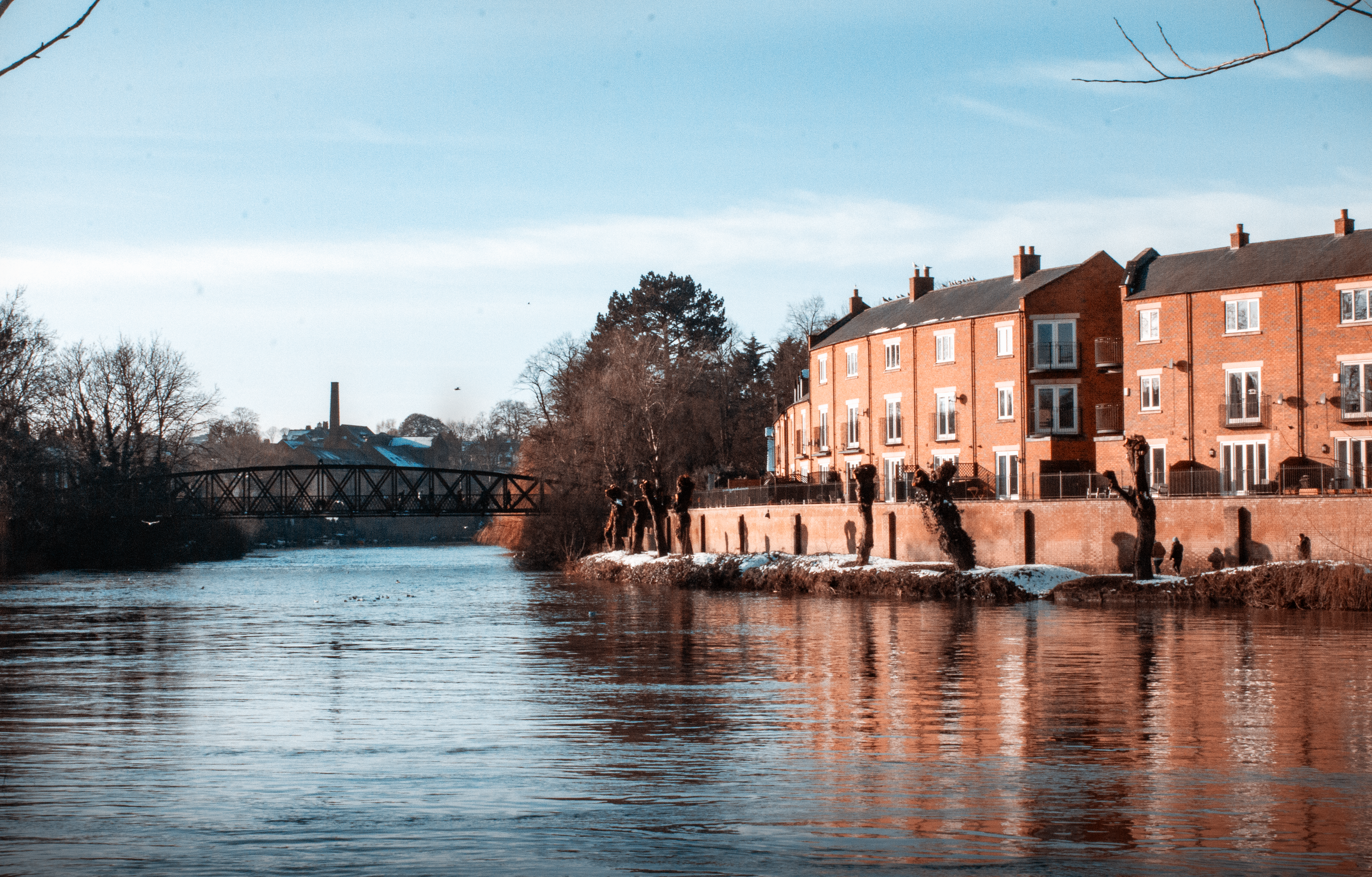 Beautiful view of buildings by the river in Shrewsbury, England, on a sunny winter day.