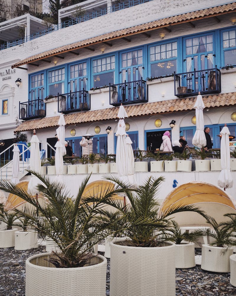 Charming Mediterranean restaurant exterior with outdoor seating