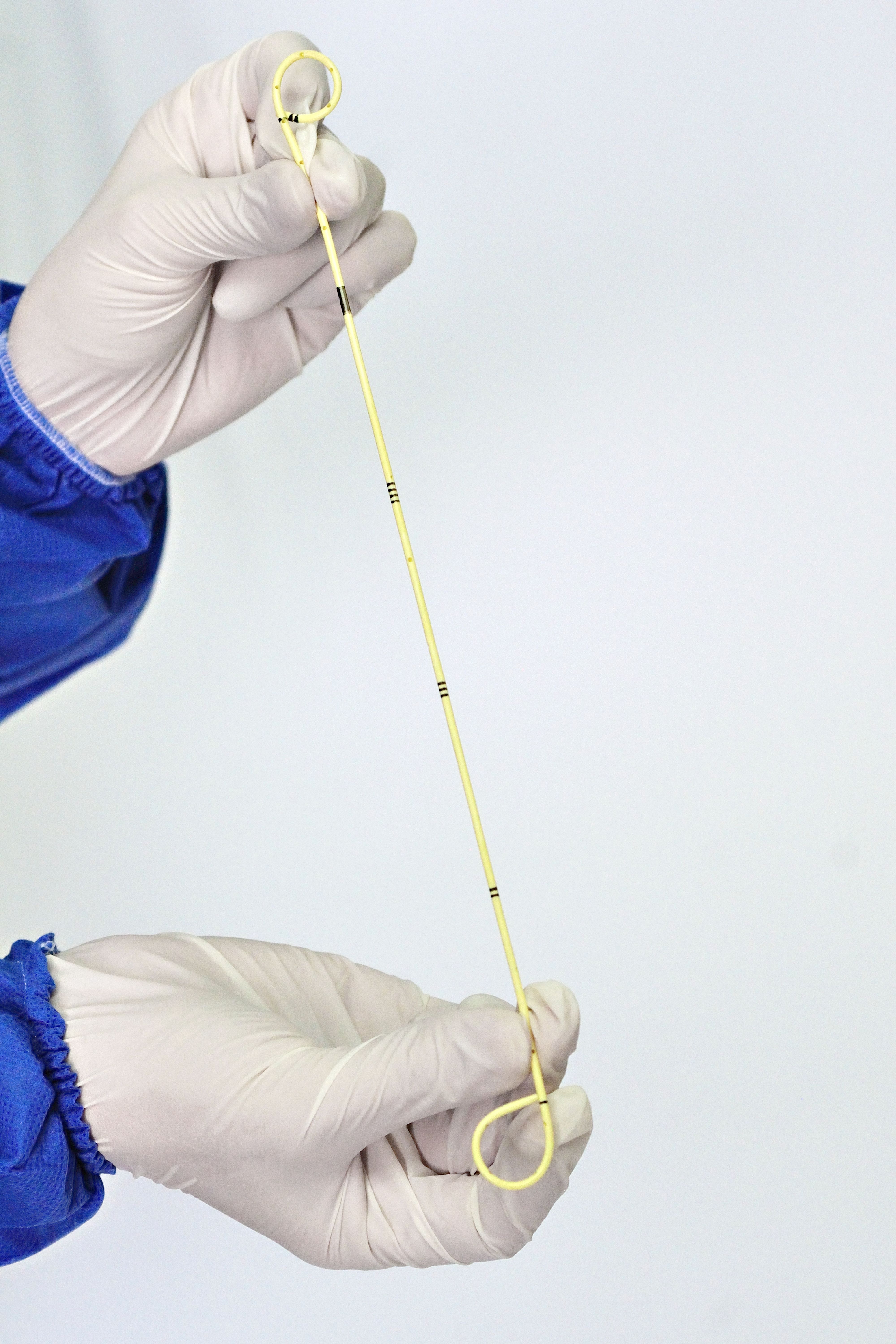 Close-up of a gloved hand holding a sterile medical swab, ideal for healthcare imagery.