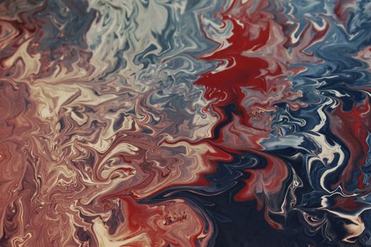 Vibrant abstract painting with swirling red, blue, and white patterns.