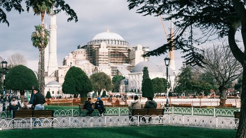 Free Hagia Sophia with vibrant park scene and people enjoying the day. Stock Photo