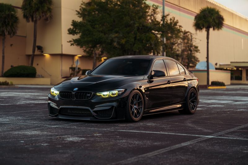 Black luxury sedan at dusk for Atlanta city taxi service