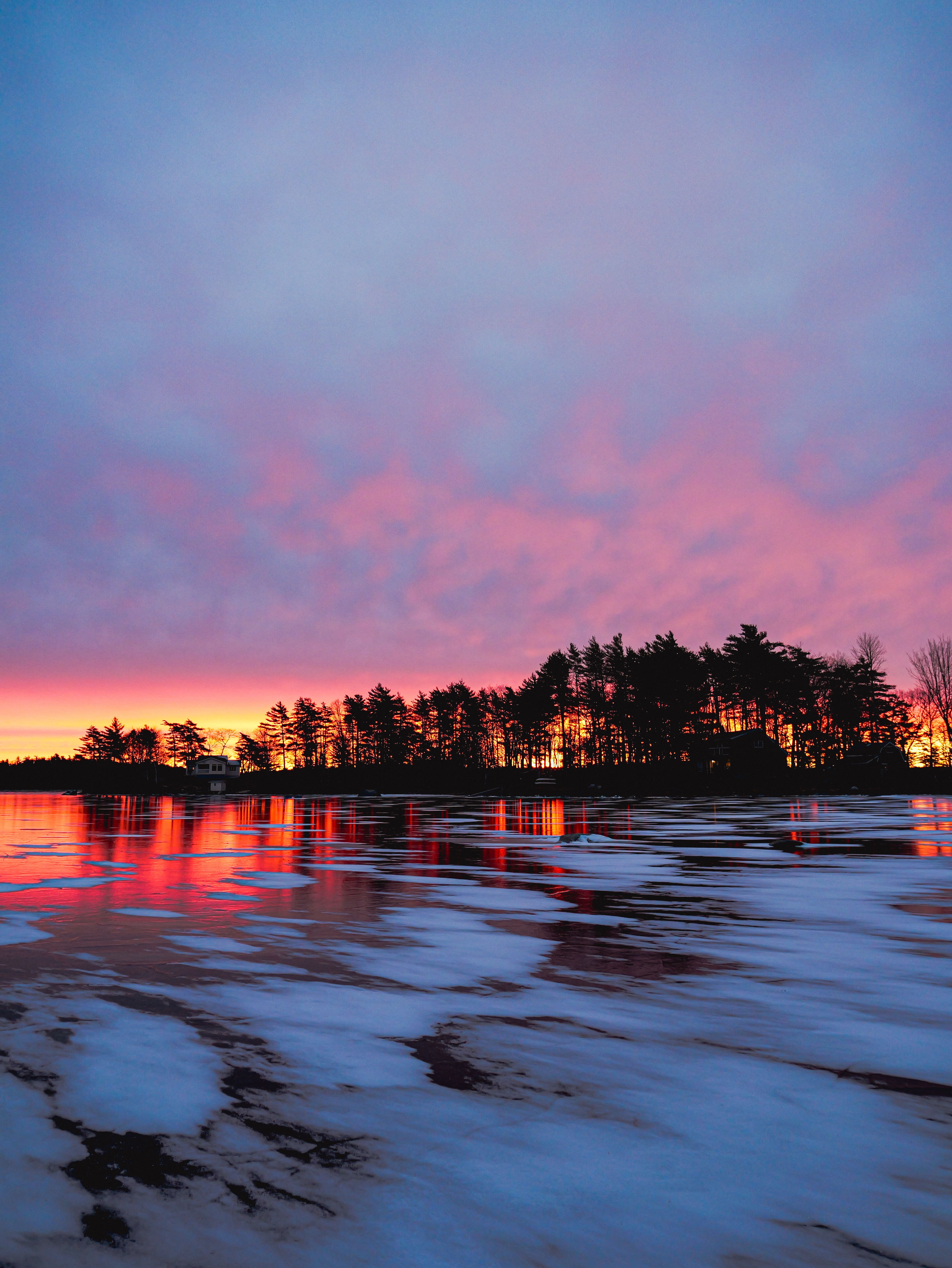 Vibrant Winter Sunset Over Frozen Lake · Free Stock Photo