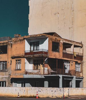 A weathered urban building with vintage charm under a clear sky, showcasing rustic architecture.