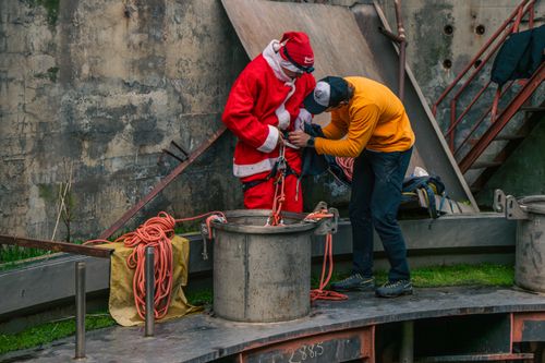 Free Santa Claus in an industrial setting preparing for an urban adventure. Stock Photo
