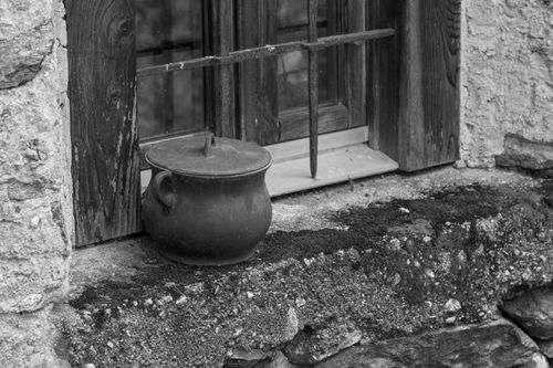 Free Black and white photo of a rustic window sill with a clay pot, evoking a classic and timeless feel. Stock Photo