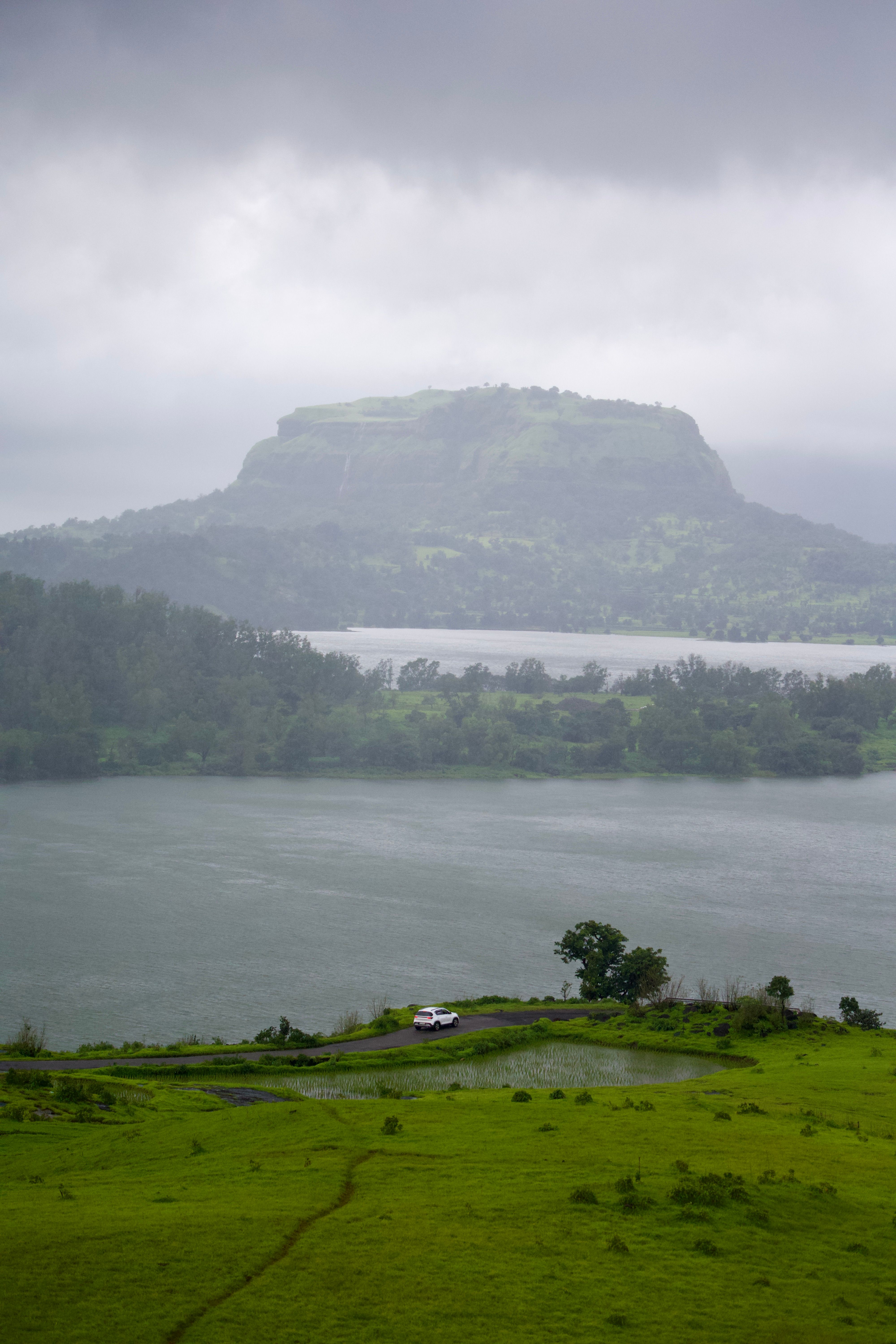 Misty hills and lake near Pune