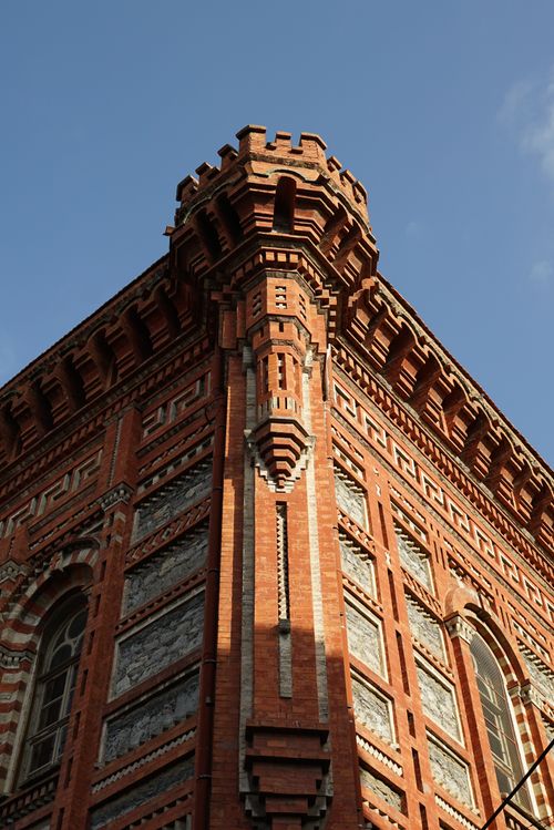 Free Ornate red brick Gothic building facade captured on a sunny day. Stock Photo