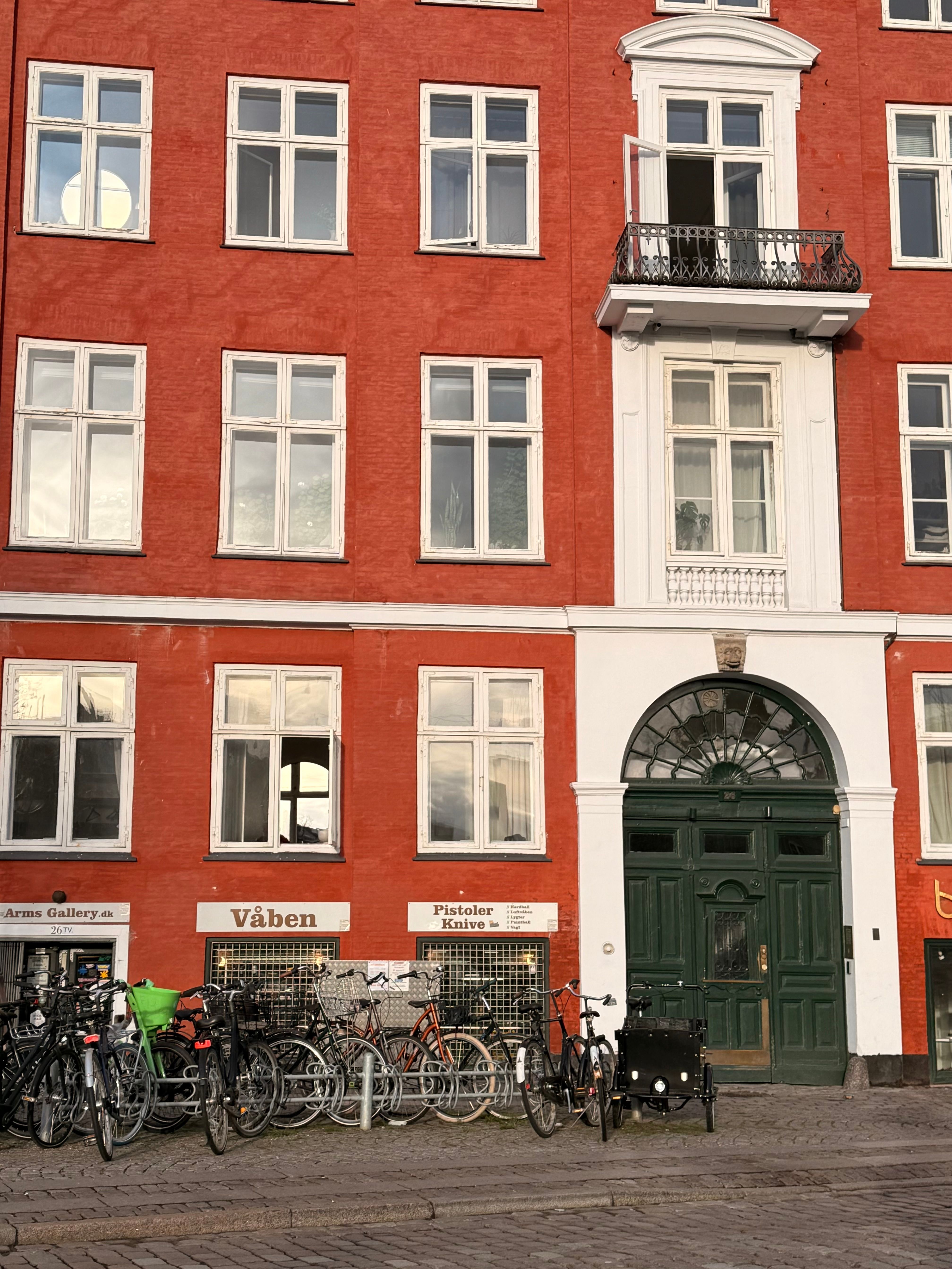 Red Brick European Building with Bicycles · Free Stock Photo