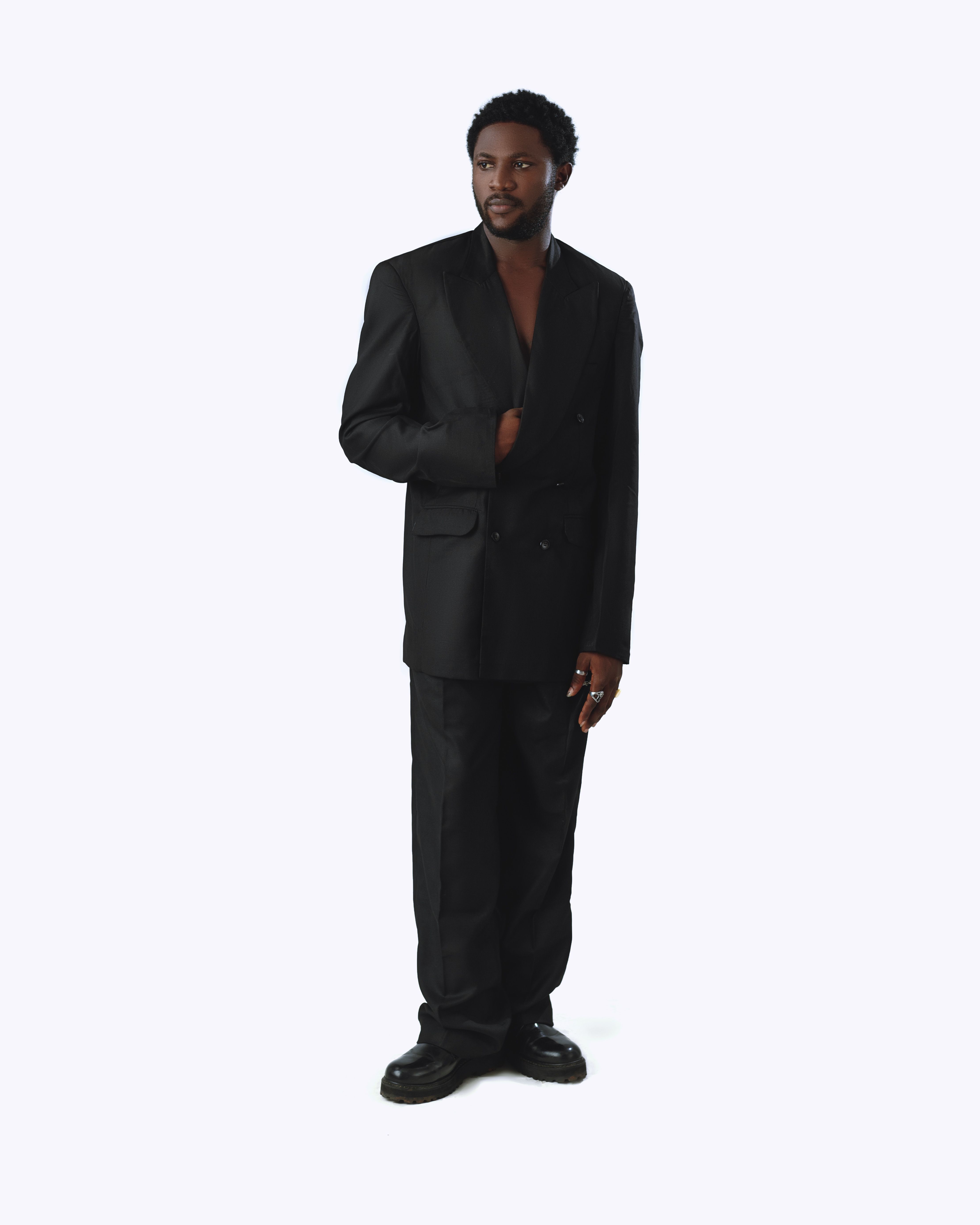 Stylish Man in Black Suit Against White Background · Free Stock Photo