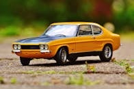 Yellow and Black Muscle Car in Tilt Shift Photography