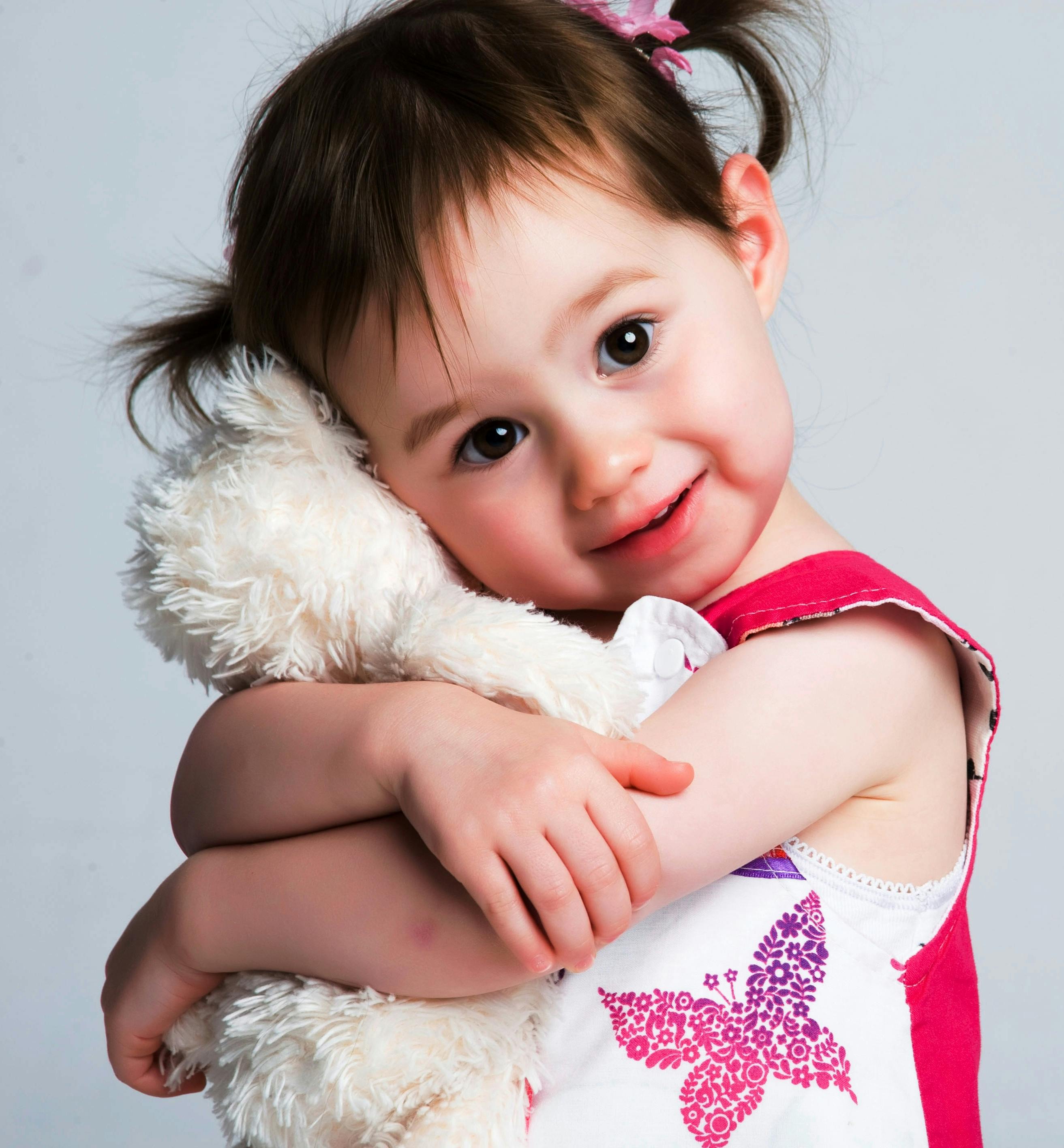 Girl Hugging Plush Toy