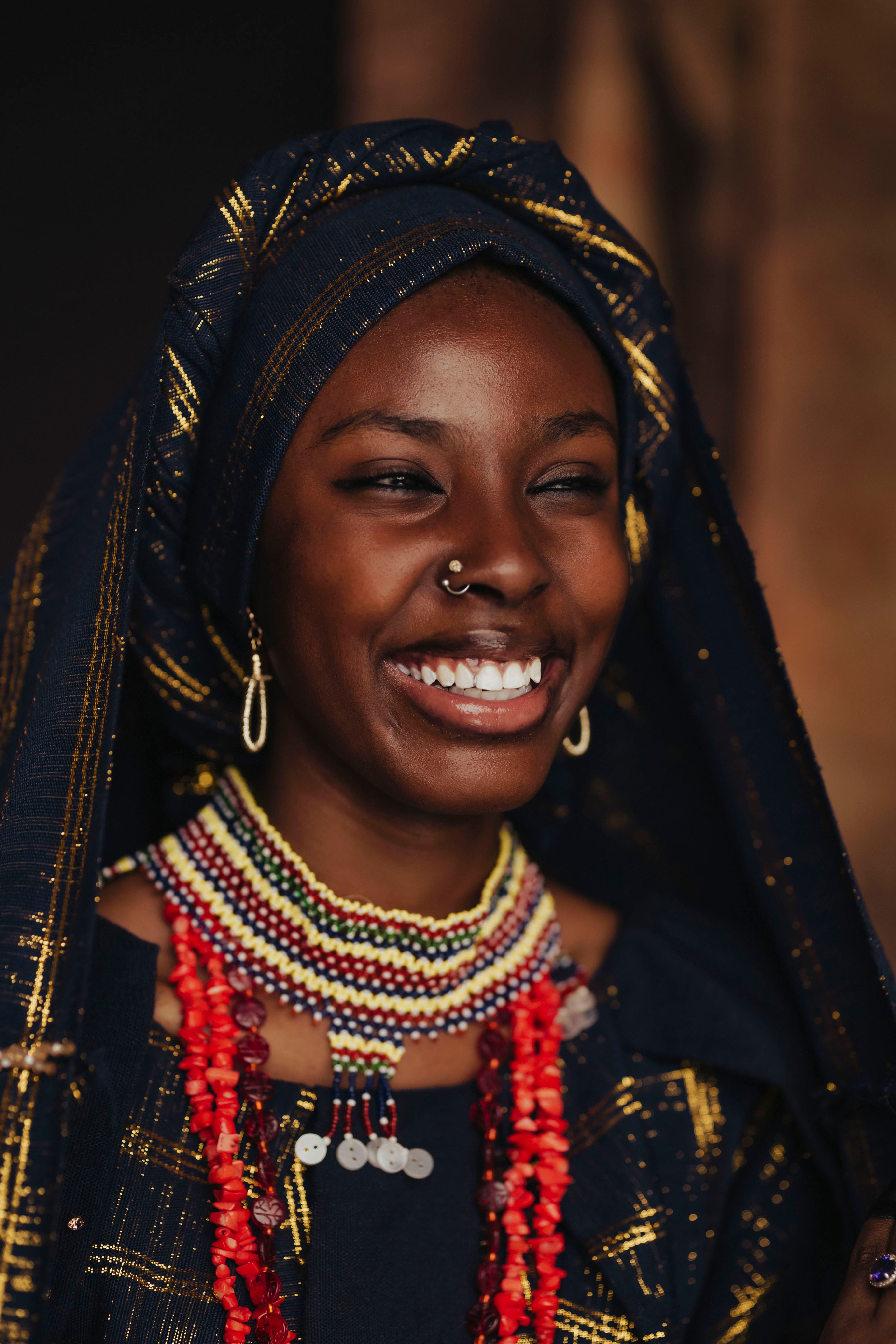 Smiling Woman in Traditional African Attire · Free Stock Photo