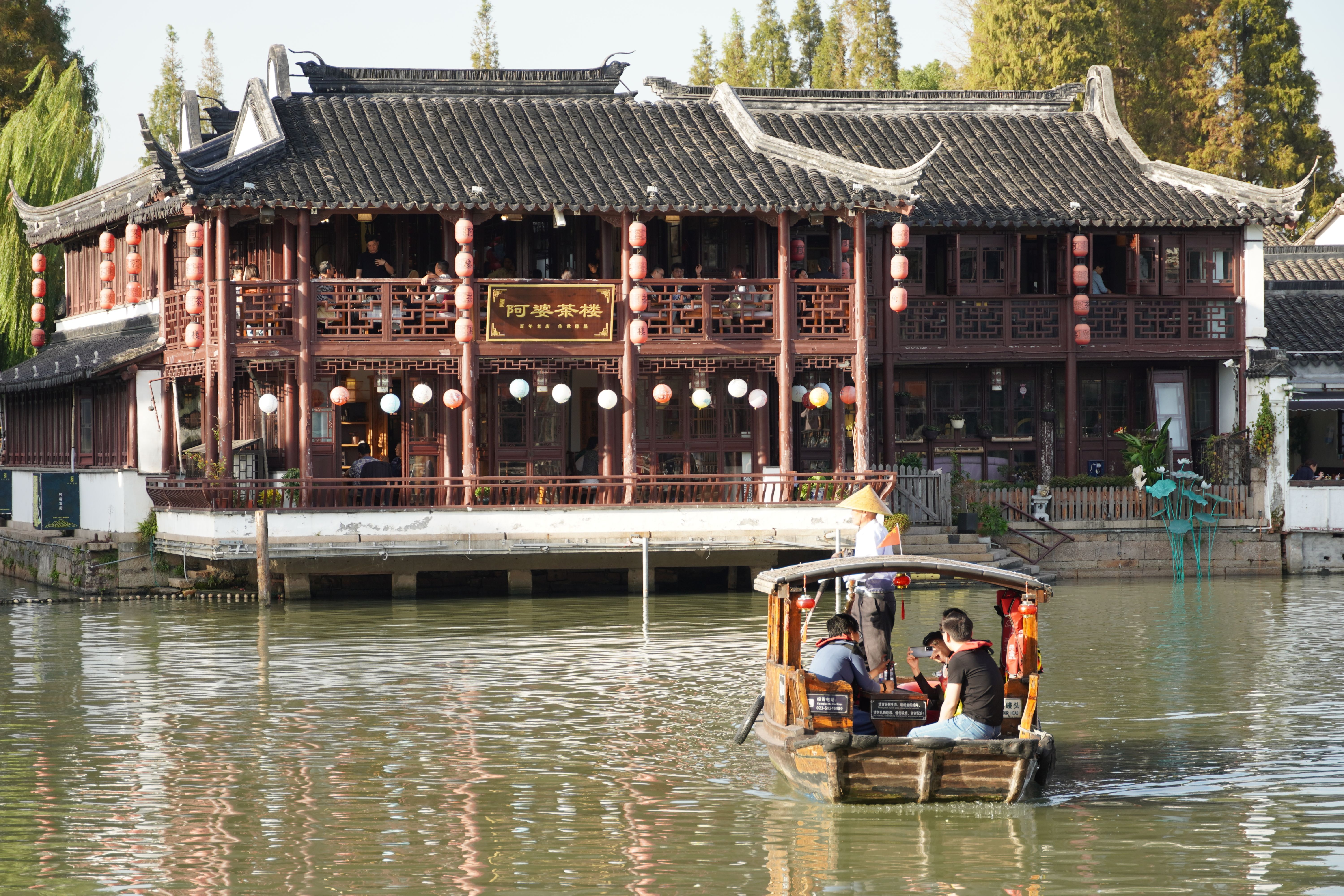 Serene Boat Ride in Traditional Chinese Town · Free Stock Photo