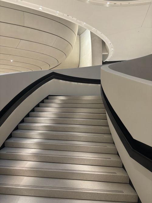Free Sleek modern staircase in a contemporary architectural setting with soft lighting. Stock Photo