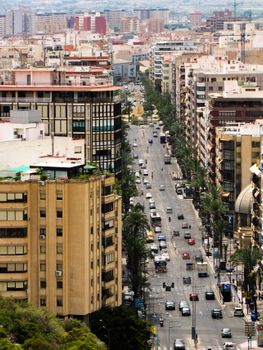 A vibrant city street in Alicante, Spain showcasing urban architecture and daily life.