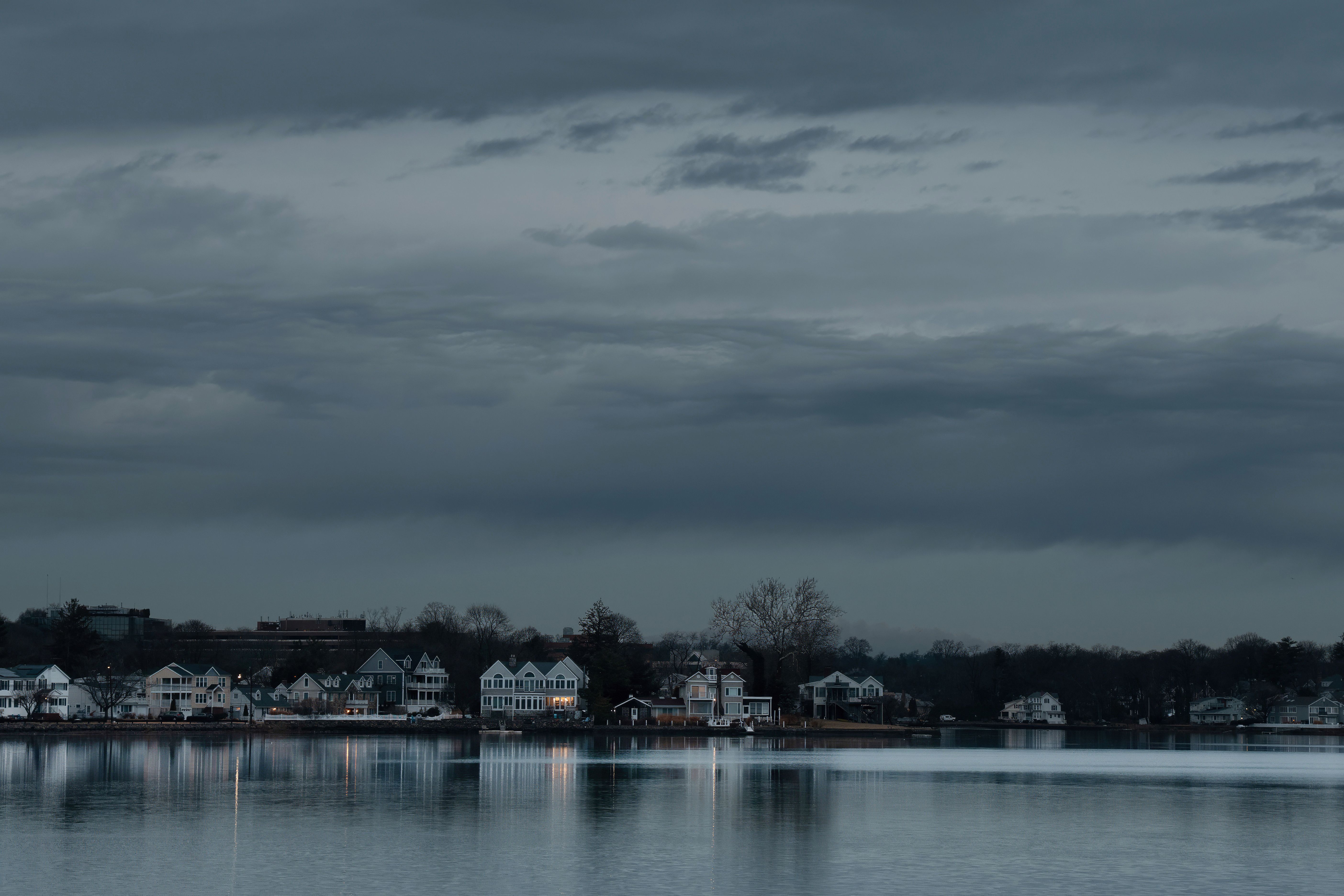 Serene dawn view of Stamford, Connecticut skyline reflecting on the water. Calm and tranquil atmosphere.