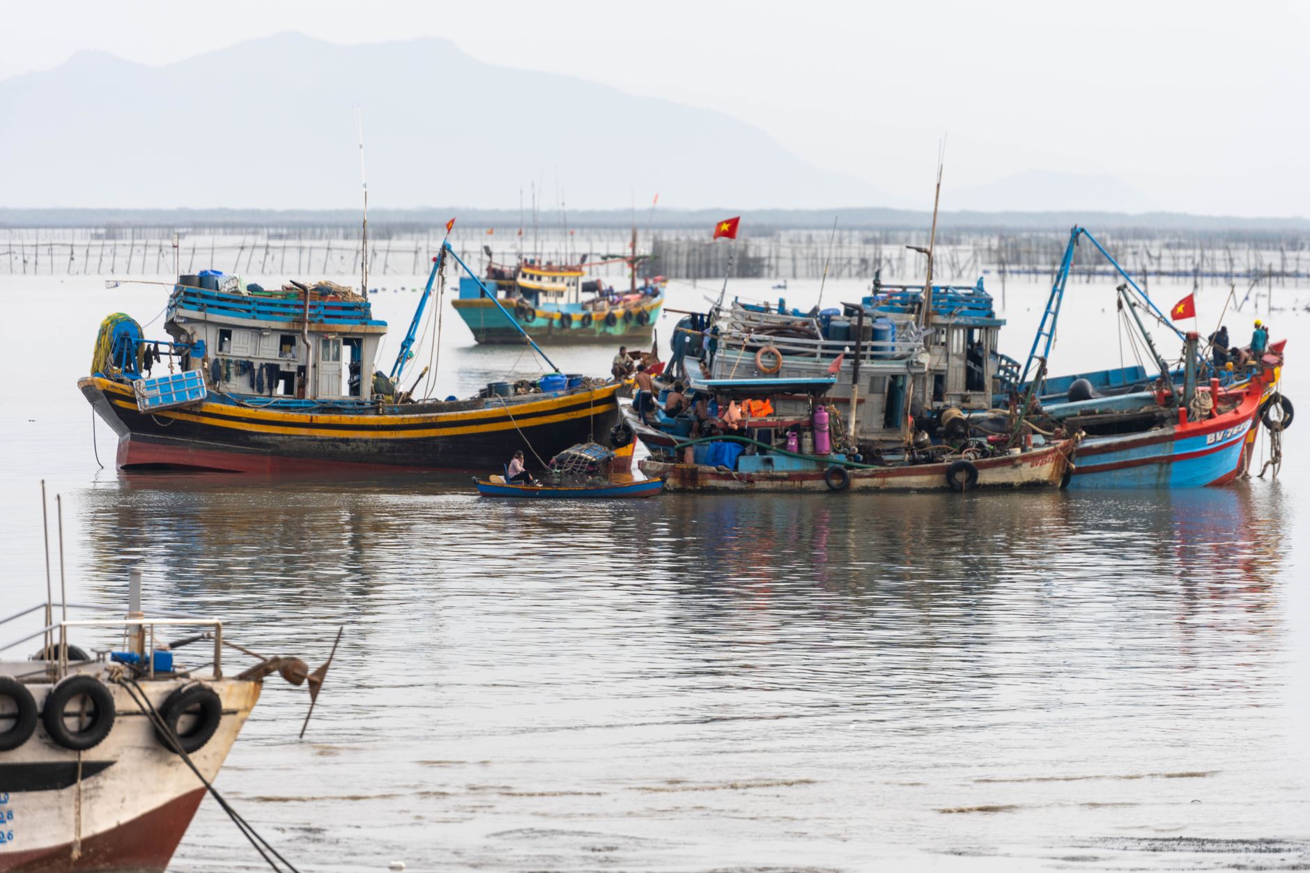 Vivid image of fishing boats in Vũng Tàu, Vietnam, showcasing local maritime life.