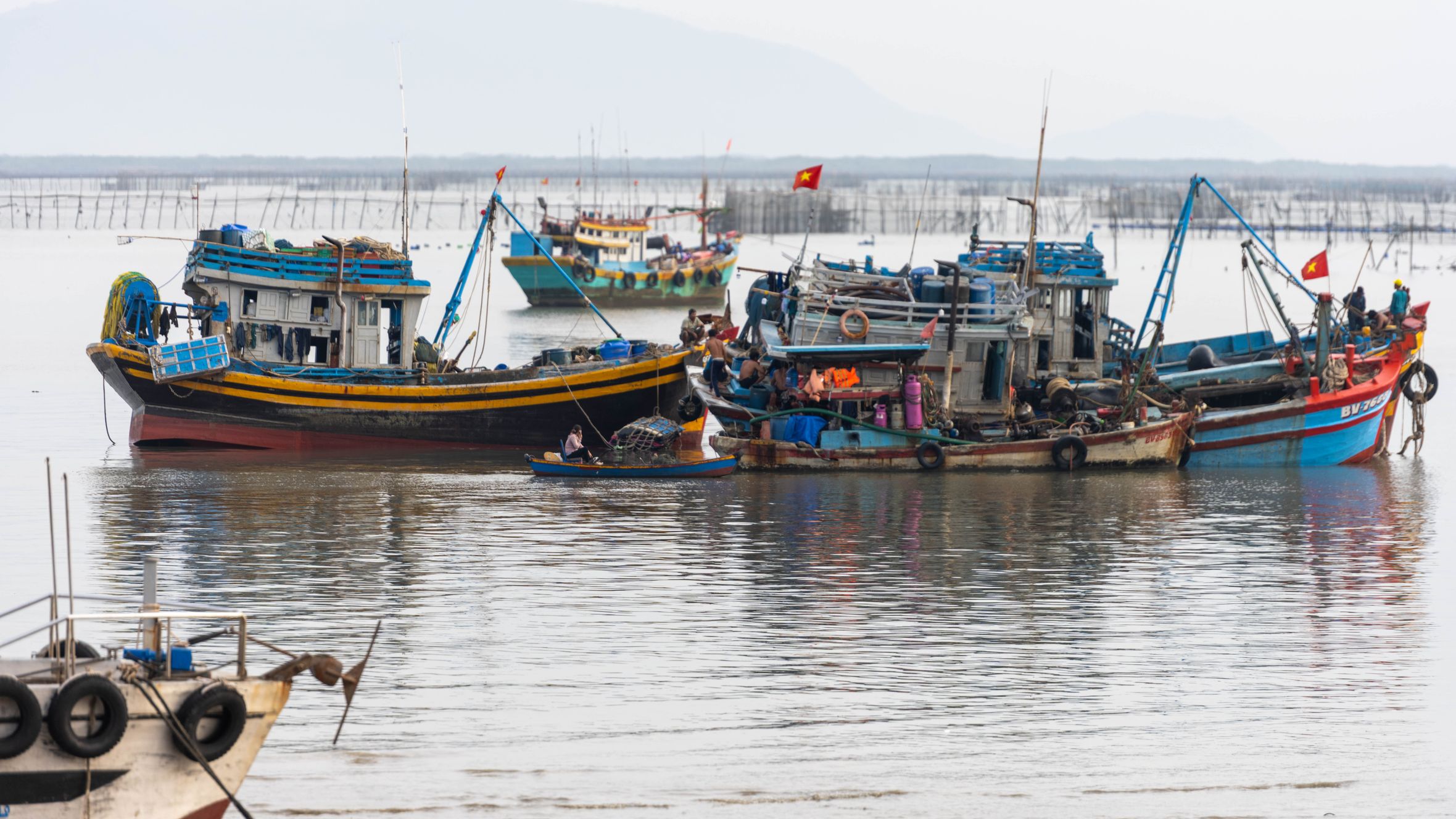 Vivid image of fishing boats in Vũng Tàu, Vietnam, showcasing local maritime life.