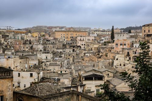 Free A panoramic view of the ancient cityscape of Matera, showcasing unique architectural styles. Stock Photo