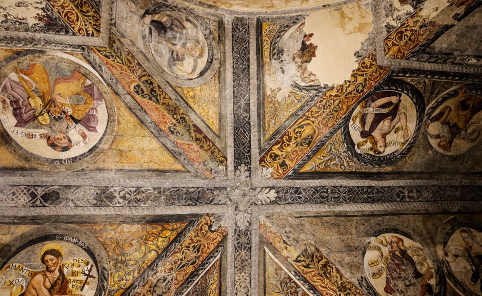 Detailed view of an ancient fresco on a cathedral ceiling, showcasing artistic heritage.